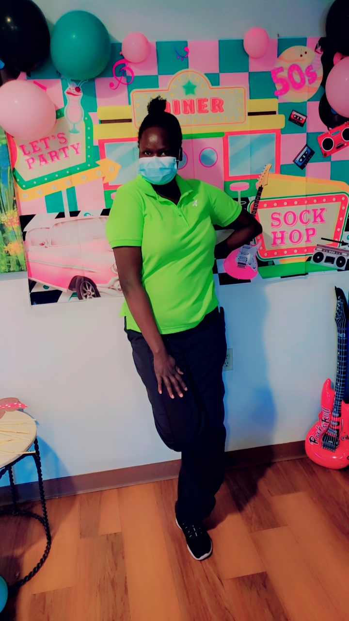 Portrait of a Selena M Barach caregiver at a resident event.